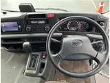 2023 Toyota Coaster GX Silver Van for sale, Japanese used car export - photo 3 of 4 | GULJI TRADERS