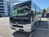 2023 Toyota Coaster GX Silver Van for sale, Japanese used car export - photo 1 of 2 | GULJI TRADERS