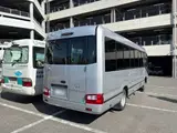 2023 Toyota Coaster GX Silver Van for sale, Japanese used car export - photo 2 of 2 | GULJI TRADERS