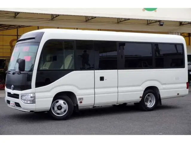 2023 Toyota Coaster LX Big Bang 9-seater - photo 1 2023 Toyota Coaster LX Big Bang 9-seater White Van for sale, Japanese used car export - photo 1 of 39 | GULJI TRADERS