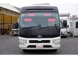 2023 Toyota Coaster LX Big Bang 9-seater White Van for sale, Japanese used car export - photo 2 of 39 | GULJI TRADERS