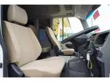 2023 Toyota Coaster LX Big Bang 9-seater White Van for sale, Japanese used car export - photo 38 of 39 | GULJI TRADERS