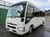 2024 Toyota Coaster Long LX White Van for sale, Japanese used car export - photo 1 of 41 | GULJI TRADERS