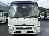 2024 Toyota Coaster Long LX White Van for sale, Japanese used car export - photo 35 of 41 | GULJI TRADERS