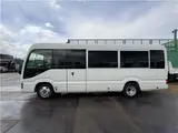 2024 Toyota Coaster Long LX White Van for sale, Japanese used car export - photo 36 of 41 | GULJI TRADERS