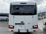 2024 Toyota Coaster Long LX White Van for sale, Japanese used car export - photo 38 of 41 | GULJI TRADERS