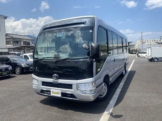 2024 Toyota Coaster GX Long 26-seater Silver Van for sale, Japanese used car export | GULJI TRADERS