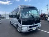 2024 Toyota Coaster GX Long 26-seater Silver Van for sale, Japanese used car export - photo 4 of 24 | GULJI TRADERS