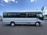 2024 Toyota Coaster GX Long 26-seater Silver Van for sale, Japanese used car export - photo 5 of 24 | GULJI TRADERS