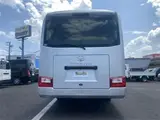 2024 Toyota Coaster GX Long 26-seater Silver Van for sale, Japanese used car export - photo 7 of 24 | GULJI TRADERS