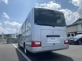 2024 Toyota Coaster GX Long 26-seater Silver Van for sale, Japanese used car export - photo 8 of 24 | GULJI TRADERS