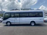 2024 Toyota Coaster GX Long 26-seater Silver Van for sale, Japanese used car export - photo 10 of 24 | GULJI TRADERS