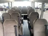 2024 Toyota Coaster GX Long 26-seater Silver Van for sale, Japanese used car export - photo 15 of 24 | GULJI TRADERS