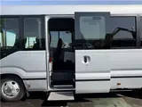 2025 Toyota Coaster Long GX Silver Van for sale, Japanese used car export - photo 30 of 44 | GULJI TRADERS