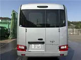 2025 Toyota Coaster Long GX Silver Van for sale, Japanese used car export - photo 33 of 44 | GULJI TRADERS