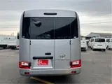 2025 Toyota Coaster GX24 passenger R double doors power heater automatic doors Silver Van for sale, Japanese used car export - photo 5 of 52 | GULJI TRADERS