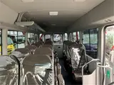 2025 Toyota Coaster GX24 passenger R double doors power heater automatic doors Silver Van for sale, Japanese used car export - photo 41 of 52 | GULJI TRADERS