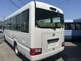 2025 Toyota Coaster LX 27 seater White Van for sale, Japanese used car export - photo 2 of 9 | GULJI TRADERS