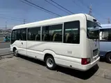 2025 Toyota Coaster LX 27 seater White Van for sale, Japanese used car export - photo 3 of 9 | GULJI TRADERS