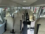 2025 Toyota Coaster LX 27 seater White Van for sale, Japanese used car export - photo 5 of 9 | GULJI TRADERS