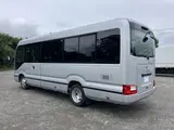 2025 Toyota Coaster Long GX ★TCS★ Automatic Swing Silver Van for sale, Japanese used car export - photo 2 of 8 | GULJI TRADERS