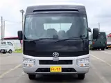 2026 Toyota Coaster Microbus GX, 28-seater, unused, current model, refrigerator, monitor. Silver Van for sale, Japanese used car export - photo 2 of 50 | GULJI TRADERS
