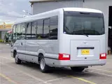 2026 Toyota Coaster Microbus GX, 28-seater, unused, current model, refrigerator, monitor. Silver Van for sale, Japanese used car export - photo 4 of 50 | GULJI TRADERS