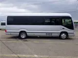 2026 Toyota Coaster Microbus GX, 28-seater, unused, current model, refrigerator, monitor. Silver Van for sale, Japanese used car export - photo 7 of 50 | GULJI TRADERS