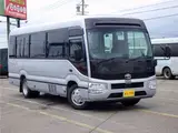 2026 Toyota Coaster Microbus GX, 28-seater, unused, current model, refrigerator, monitor. Silver Van for sale, Japanese used car export - photo 8 of 50 | GULJI TRADERS
