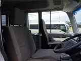 2026 Toyota Coaster Microbus GX, 28-seater, unused, current model, refrigerator, monitor. Silver Van for sale, Japanese used car export - photo 28 of 50 | GULJI TRADERS
