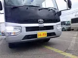 2026 Toyota Coaster Microbus GX, 28-seater, unused, current model, refrigerator, monitor. Silver Van for sale, Japanese used car export - photo 46 of 50 | GULJI TRADERS