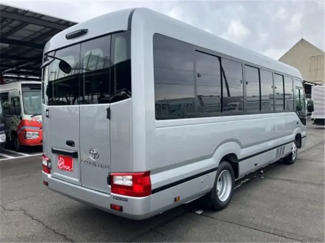 2026 Toyota Coaster GX25 passenger rear double doors automatic doors - photo 1 2026 Toyota Coaster GX25 passenger rear double doors automatic doors Silver Van for sale, Japanese used car export - photo 1 of 52 | GULJI TRADERS
