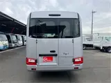 2026 Toyota Coaster GX25 passenger rear double doors automatic doors Silver Van for sale, Japanese used car export - photo 5 of 52 | GULJI TRADERS