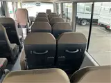 2026 Toyota Coaster GX25 passenger rear double doors automatic doors Silver Van for sale, Japanese used car export - photo 50 of 52 | GULJI TRADERS