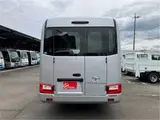 2026 Toyota Coaster GX25 passenger rear double doors automatic doors navigation Silver Van for sale, Japanese used car export - photo 5 of 54 | GULJI TRADERS