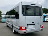 2026 Toyota Coaster GX Silver Van for sale, Japanese used car export - photo 7 of 30 | GULJI TRADERS