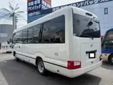 2026 Toyota Coaster Long LX Turbo White Van for sale, Japanese used car export - photo 6 of 9 | GULJI TRADERS