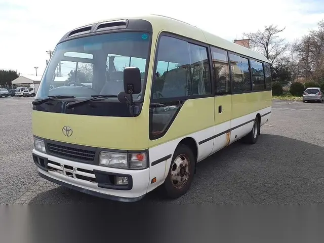 2007 Toyota Coaster Long Gx 26 Seater Yellow Van for sale, Japanese used car export | GULJI TRADERS