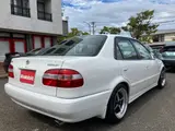 1998 Toyota Corolla GT 6-speed manual transmission, Equip alloy wheels White Sedan for sale, Japanese used car export - photo 22 of 24 | GULJI TRADERS