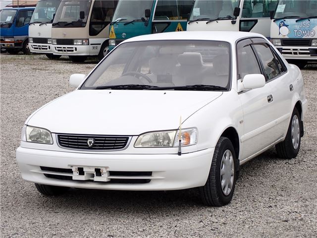 1999 Toyota Corolla SE Saloon Rivière - photo 1 1999 Toyota Corolla SE Saloon Rivière White Sedan for sale, Japanese used car export | GULJI TRADERS