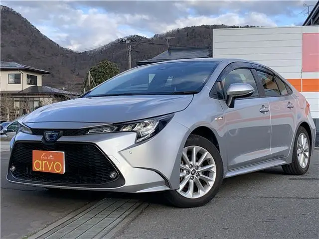 2019 Toyota Corolla Hybrid S 4WD - photo 1 2019 Toyota Corolla Hybrid S 4WD Silver Sedan for sale, Japanese used car export - photo 1 of 44 | GULJI TRADERS