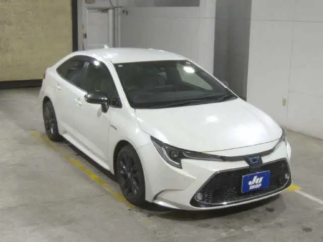 2019 Toyota Corolla Hybrid WxB - photo 1 2019 Toyota Corolla Hybrid WxB Pearl Sedan for sale, Japanese used car export - photo 1 of 7 | GULJI TRADERS