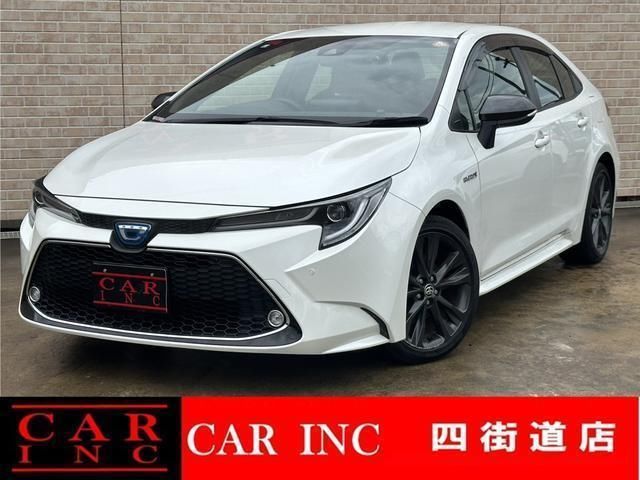 2019 Toyota Corolla Hybrid Sedan for sale, Japanese used car export - photo 1 of 9 | GULJI TRADERS