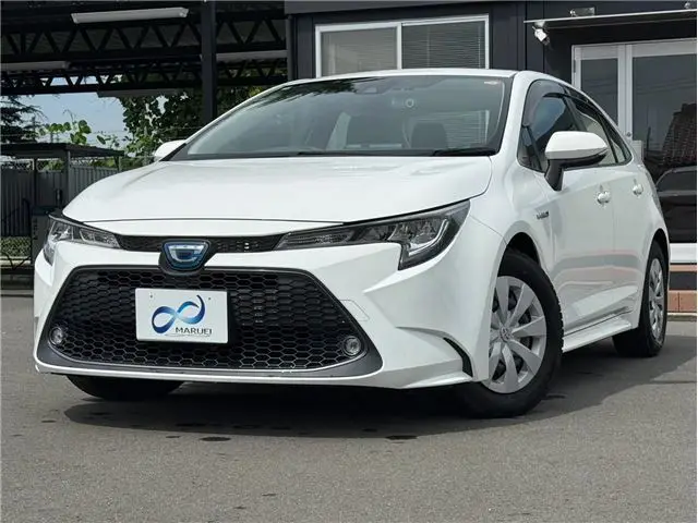 2020 Toyota Corolla Hybrid G-X 4WD White Sedan for sale, Japanese used car export - photo 1 of 36 | GULJI TRADERS