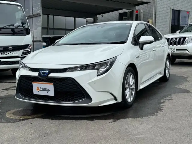 2020 Toyota Corolla Hybrid SE-FOUR - photo 1 2020 Toyota Corolla Hybrid SE-FOUR Pearl Sedan for sale, Japanese used car export - photo 1 of 77 | GULJI TRADERS