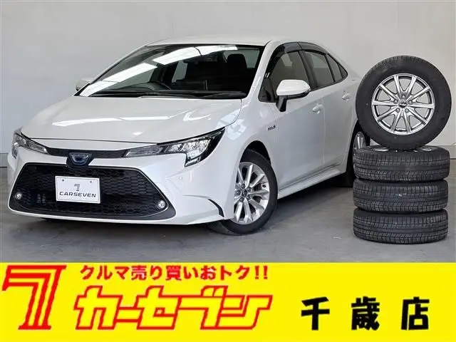 2020 Toyota Corolla 1.8HYBRID S 4WD Pearl Sedan for sale, Japanese used car export - photo 1 of 30 | GULJI TRADERS