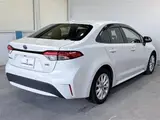 2020 Toyota Corolla 1.8HYBRID S 4WD Pearl Sedan for sale, Japanese used car export - photo 12 of 30 | GULJI TRADERS