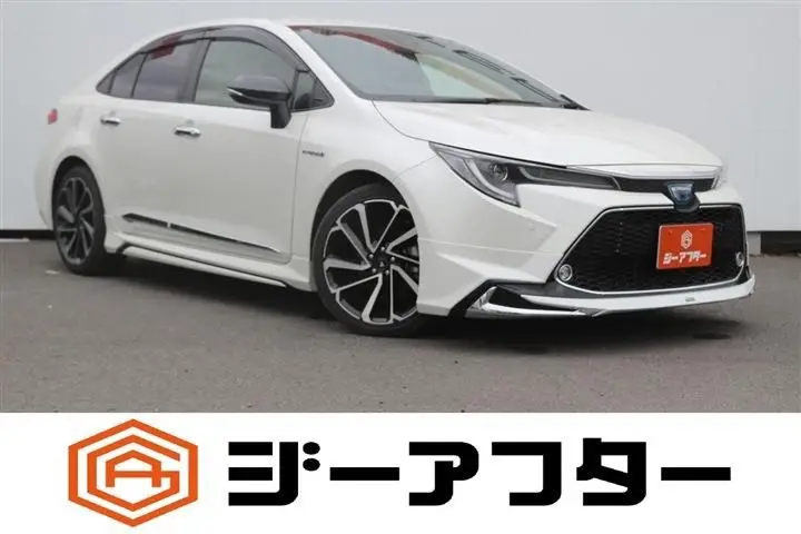 2020 Toyota Corolla 1.8HYBRID WxB - photo 1 2020 Toyota Corolla 1.8HYBRID WxB Pearl Sedan for sale, Japanese used car export - photo 1 of 30 | GULJI TRADERS