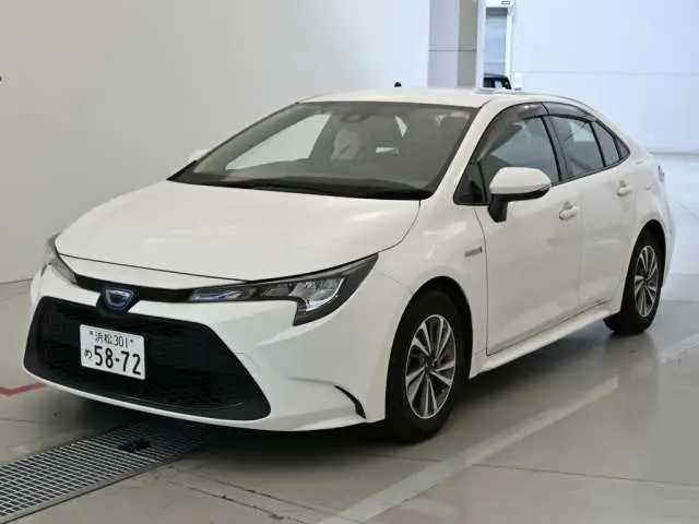 2020 Toyota Corolla Hybrid G-X - photo 1 2020 Toyota Corolla Hybrid G-X White Sedan for sale, Japanese used car export - photo 1 of 12 | GULJI TRADERS