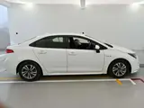 2020 Toyota Corolla Hybrid G-X White Sedan for sale, Japanese used car export - photo 3 of 12 | GULJI TRADERS